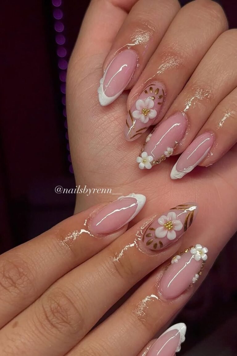3D flowers on crisp French tips = instant elegance.