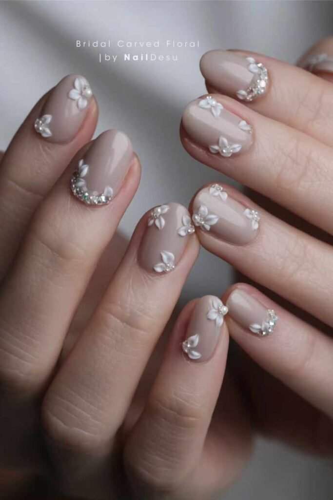 Intricately carved 3D white blossom nail art, perfect for bold and artistic bridal nails.