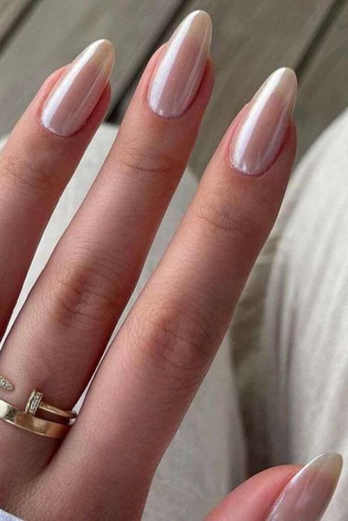 Chrome wedding nails with a glazed finish reflecting silvery white hues, a modern bridal nail trend.