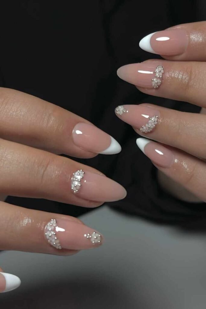 French tips and single pearl accents, creating a minimal yet elegant look.