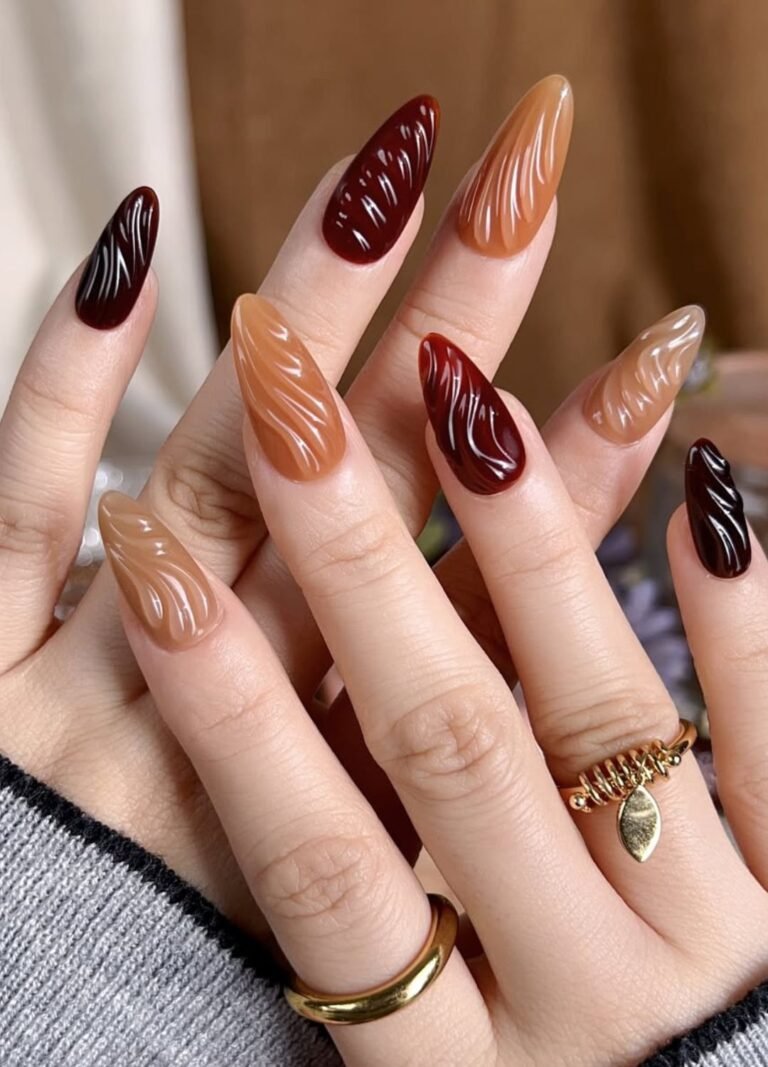 These brown nails look playful with texture and dimension by layering different shades of brown in 3D accents