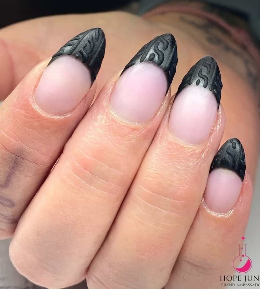 Black sweater nails texture featuring a black French sweater on a nude bas