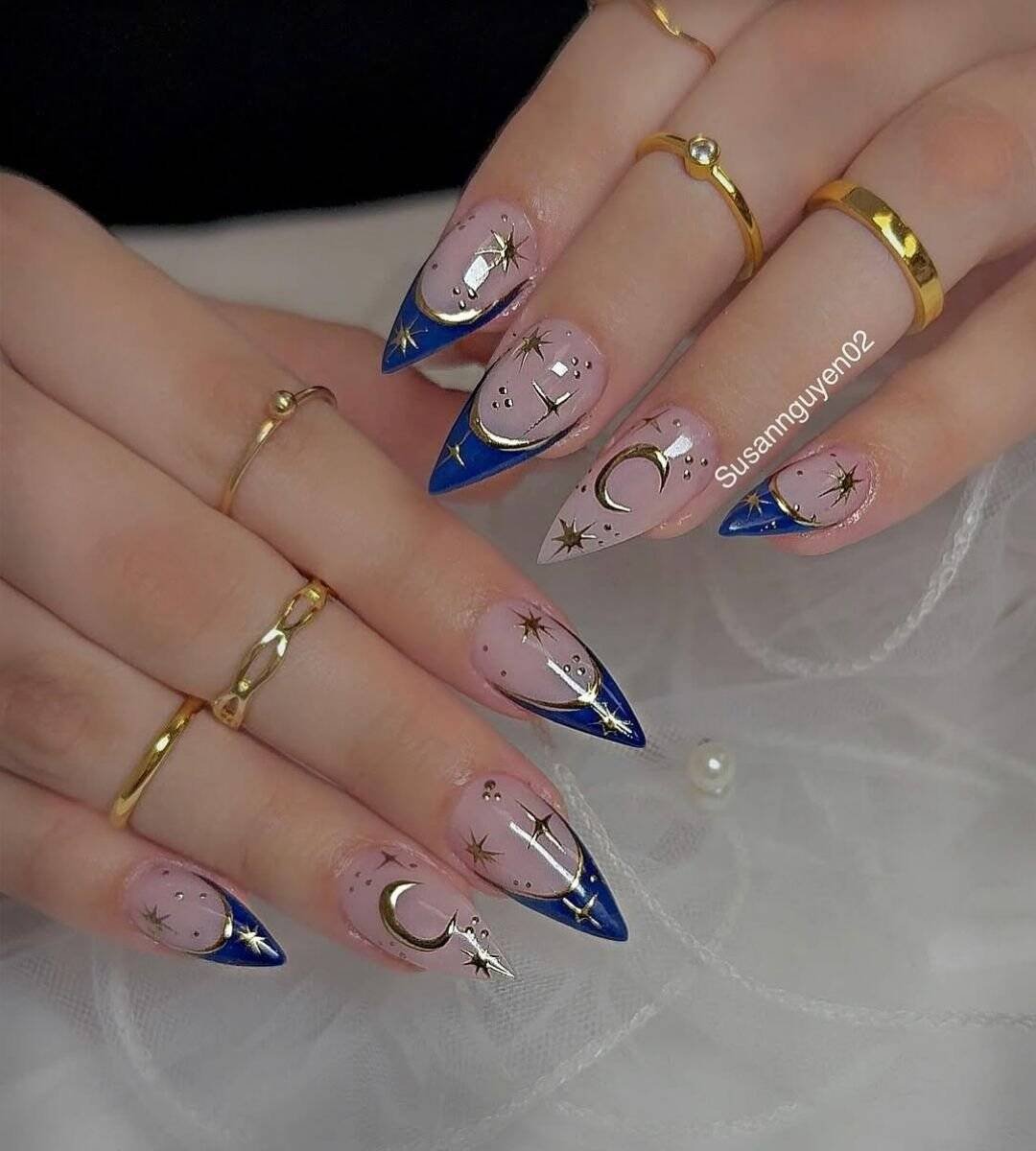 Blue Nails with a twist on the French tip, metallic blue chrome with a sleek finish