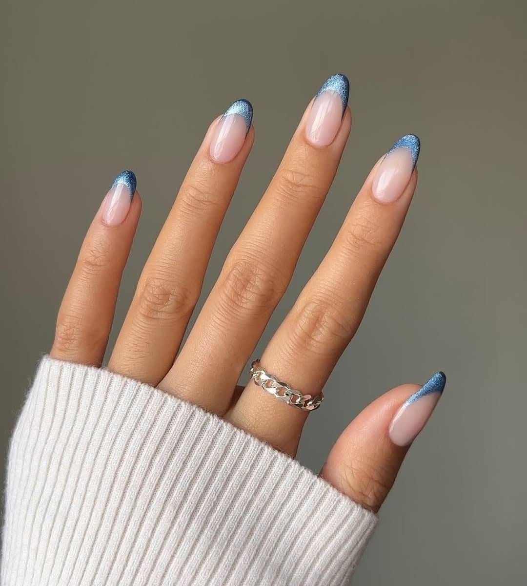 Blue cat eye French tips nails with clean and classy finishing.