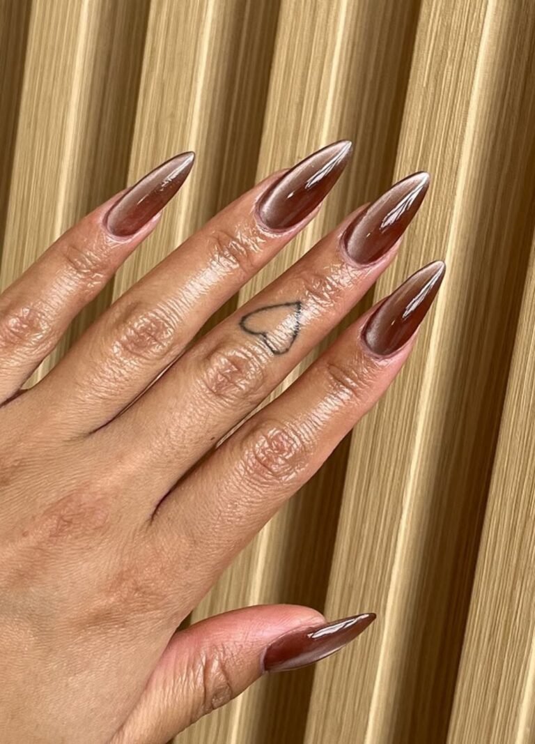 This magnetic, magical cat-eye nail design in chocolate brown gives off a sultry, shimmering effect. 