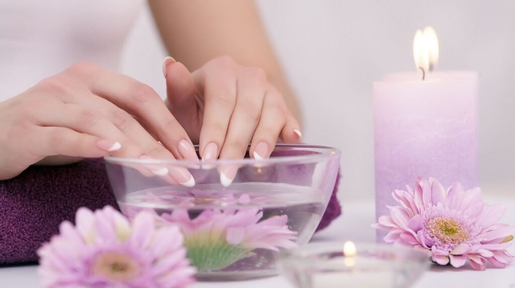 Healthy nails tips with food for healthy nails and nail care at home — salmon, greens, avocado, quinoa, and cuticle oil for stronger nails.