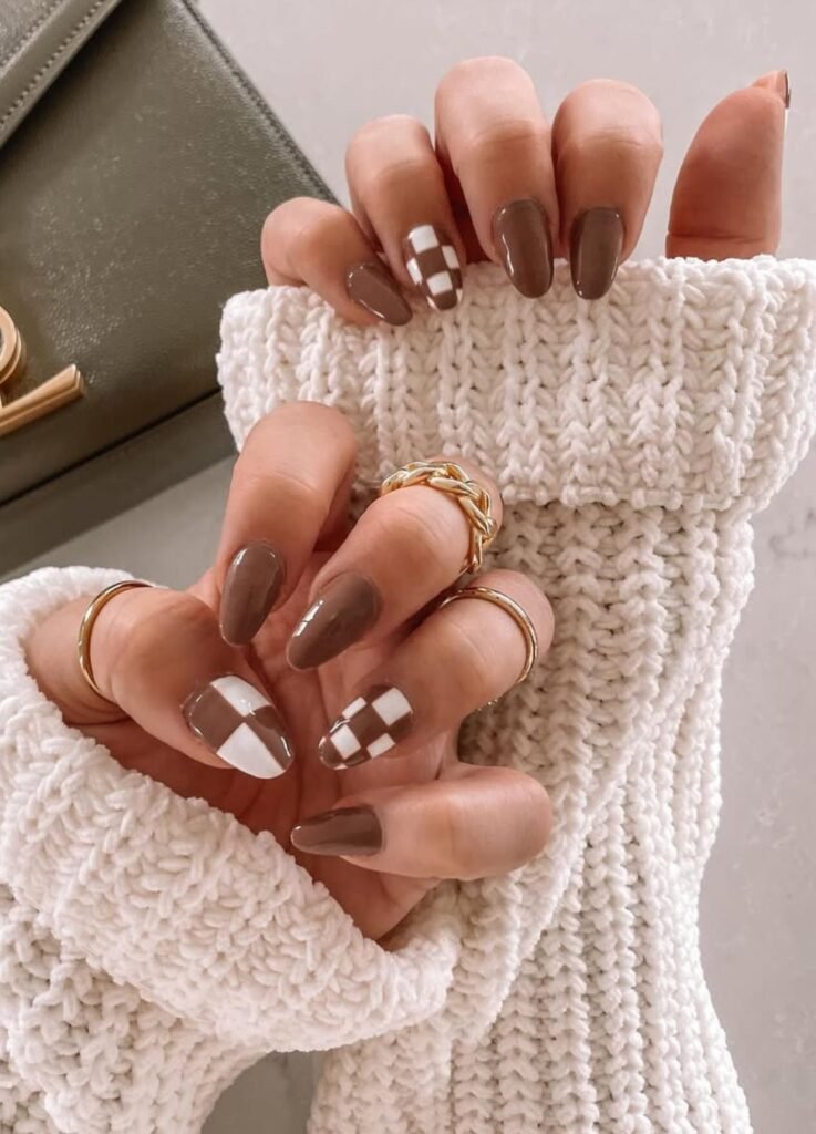 Thanksgiving Nail ideas

This mani captures that mood with a checkerboard design in chocolate browns and creamy white