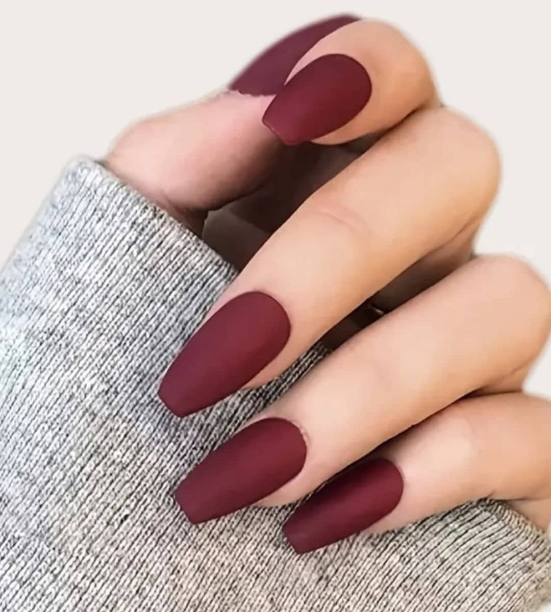 Image of Deep wine red nails with a matte finish