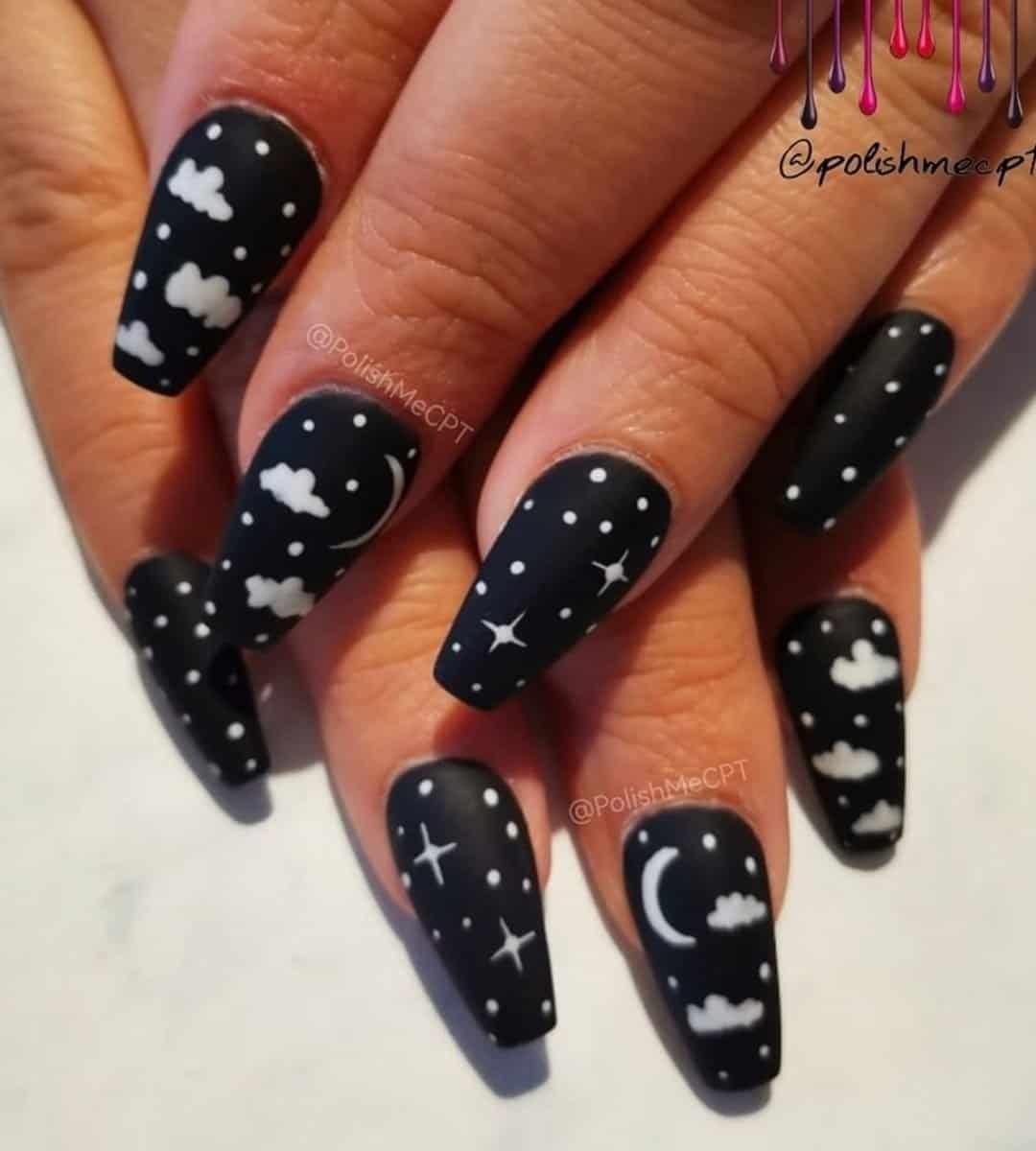 Black Nails with stunning design featuring white polka dots, half moon, stars and cloud on a black base