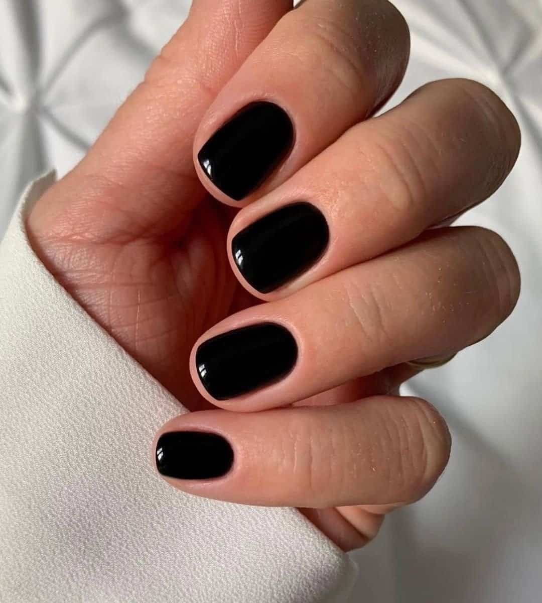 Short glossy black nails like glass