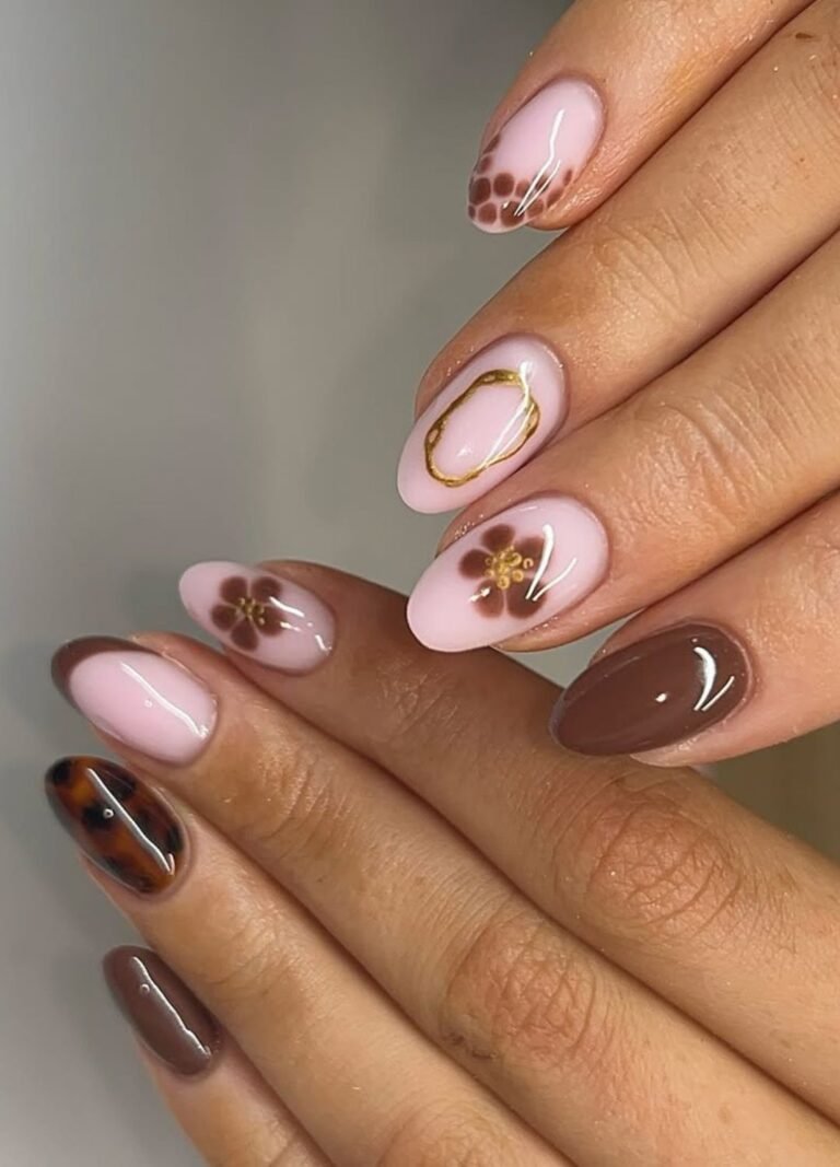 This nail art design is neutral but interesting with nude nails featuring brown patterned details, tortoise shell, and plain