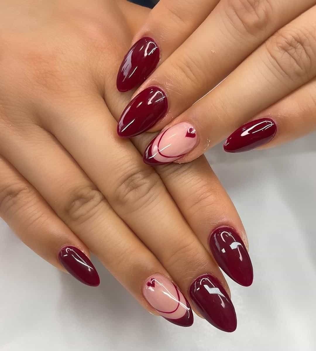 Display of Red Acrylic Nails With French & Hearts