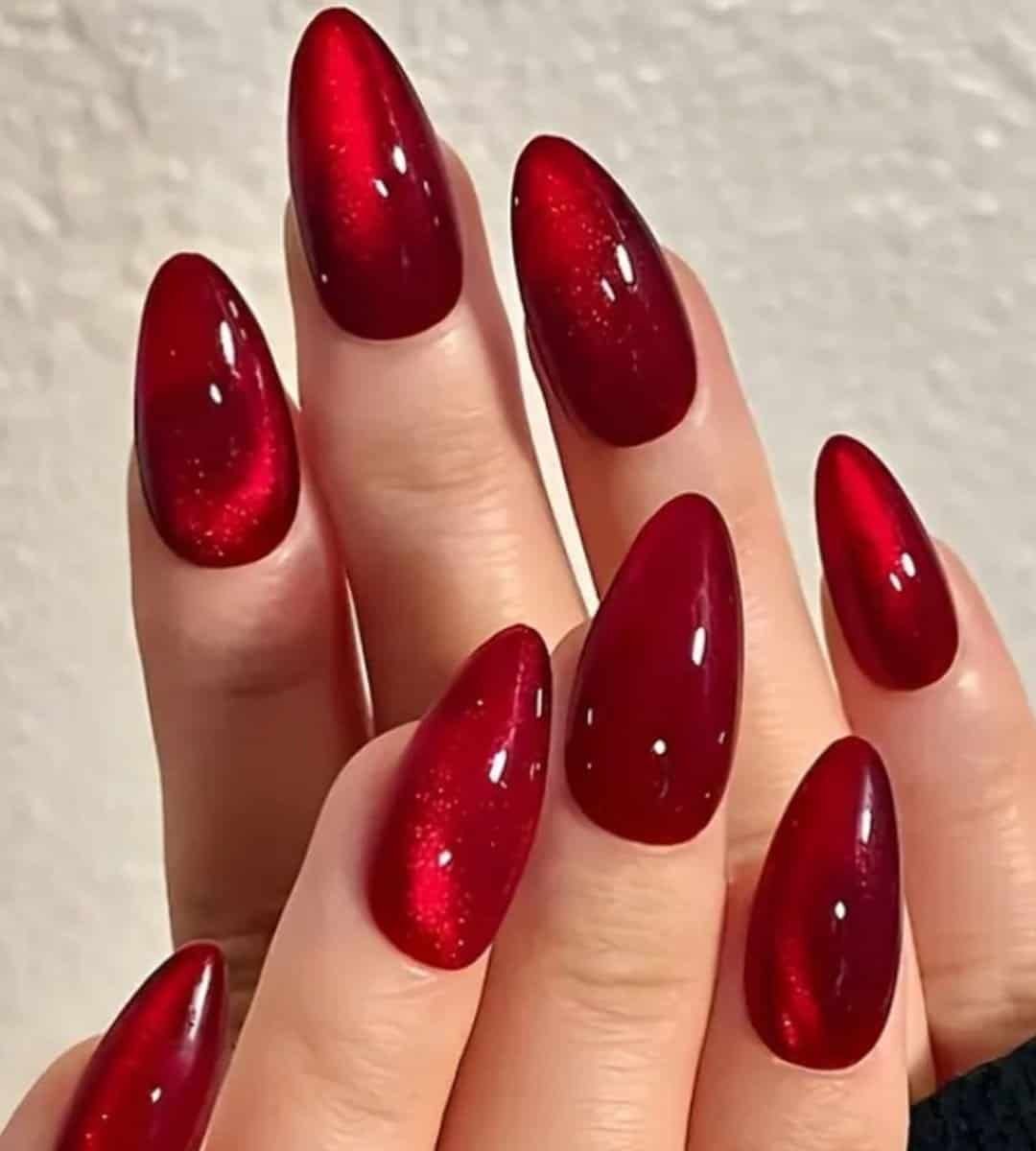 Image of glossy cat-eye nails in solid red colour