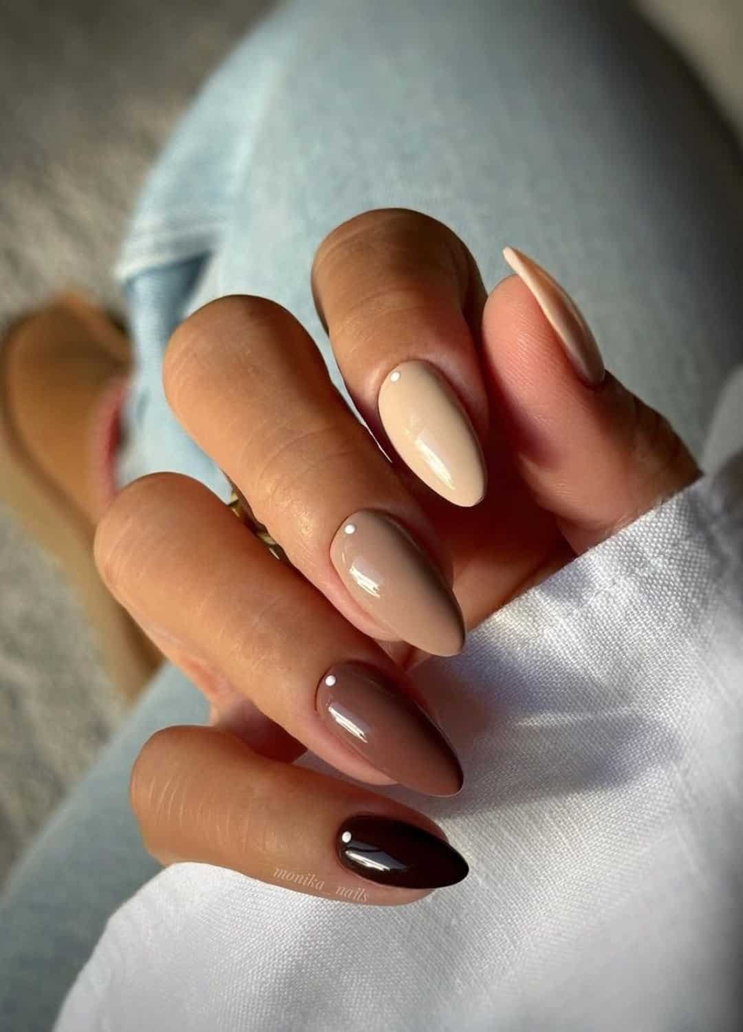 hands showing shades of brown nails -- from dark brown nails to coffee, and latte nails