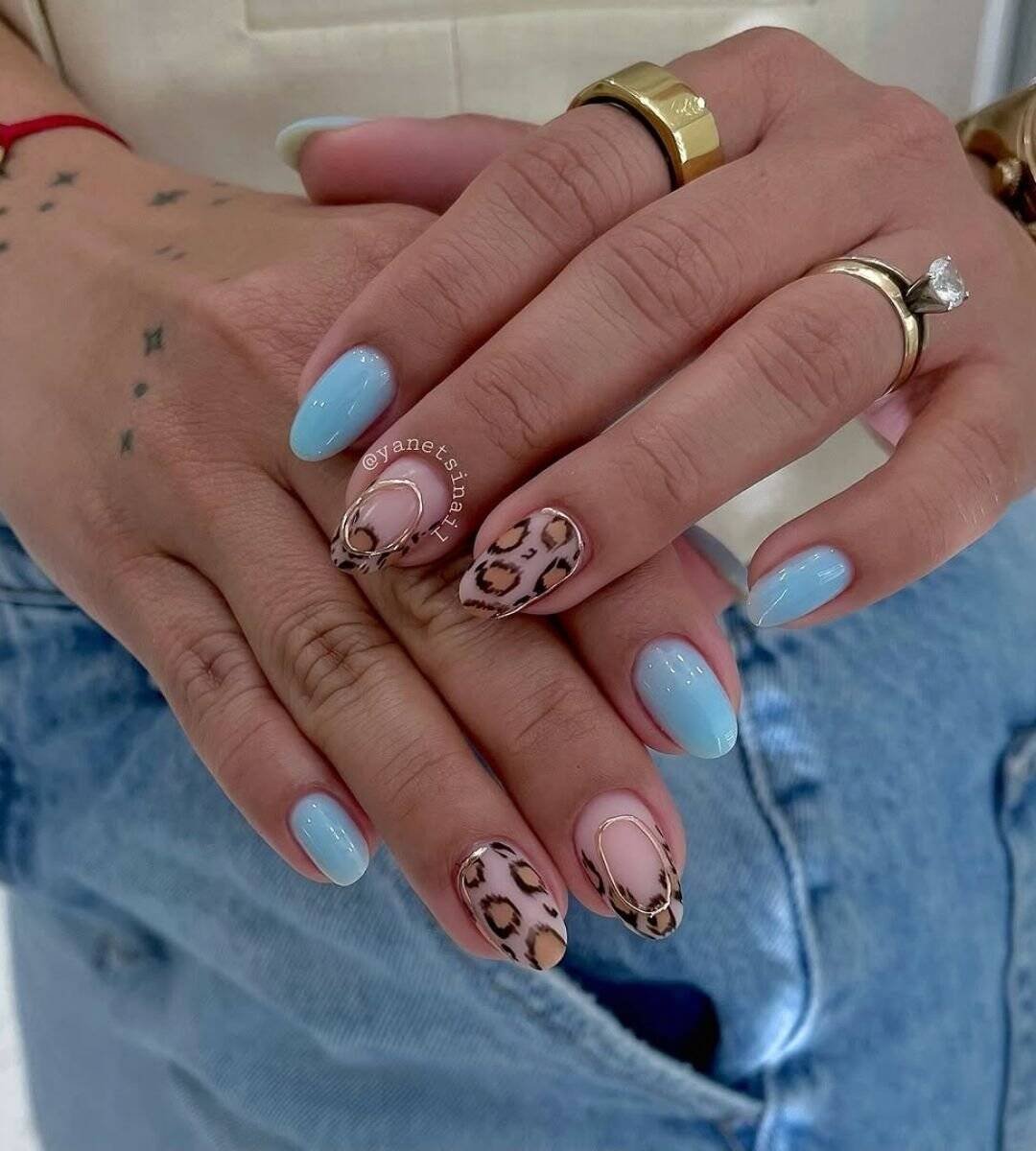 Sky Blue Nails & Leopard Skin
Yes, leopard print works with blue, and it looks insanely chic. The sky blue keeps it playful while the animal print adds edge.