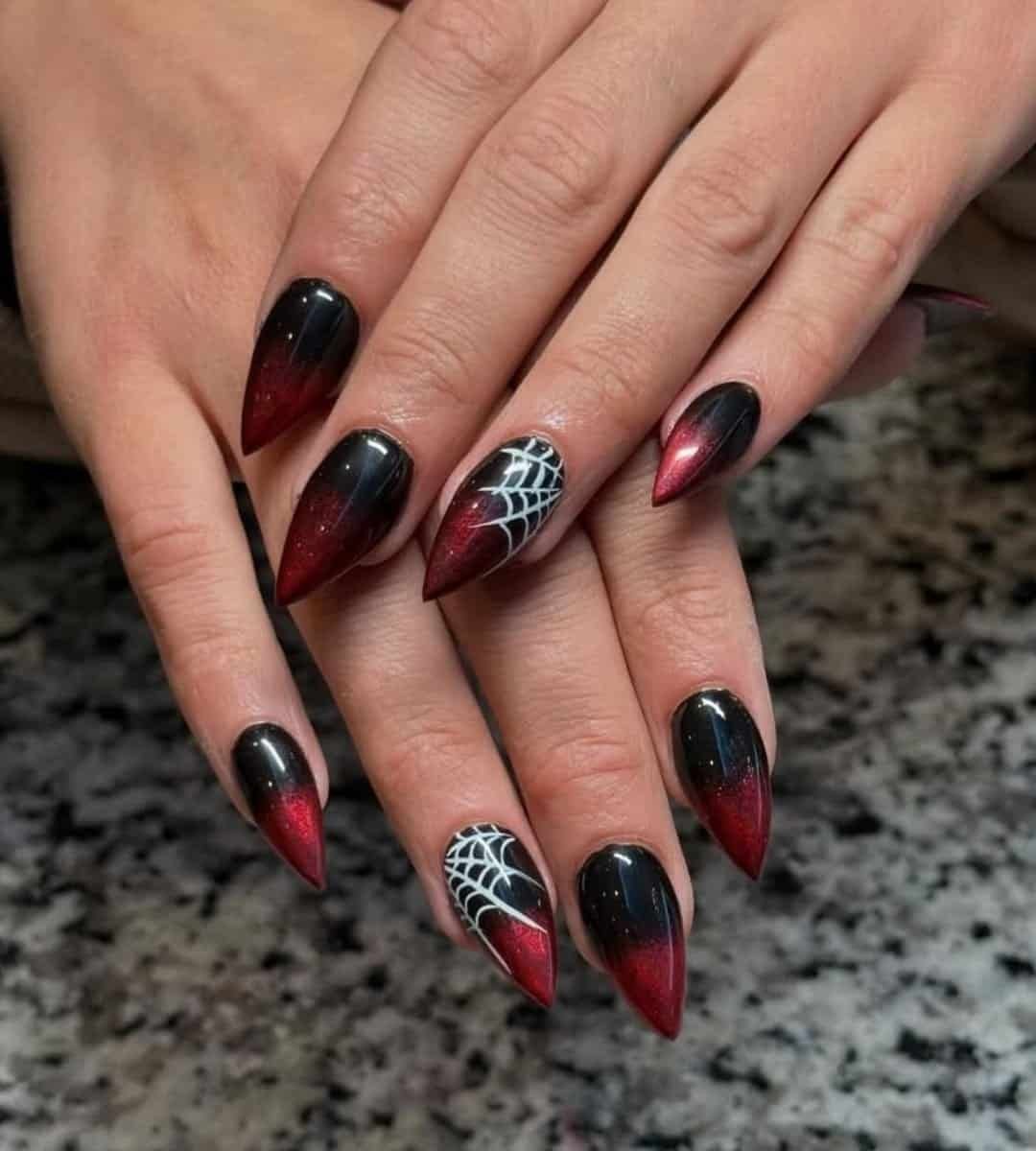 Image of Dark red and Black ombre nails with white spider web details are perfect for Halloween 