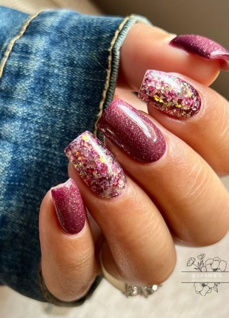 Picture of nails featuring purple glitter combined with accents in gold and multiple colours. 